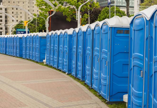 portable restrooms lined up at a marathon, ensuring runners can take a much-needed bathroom break in Groesbeck